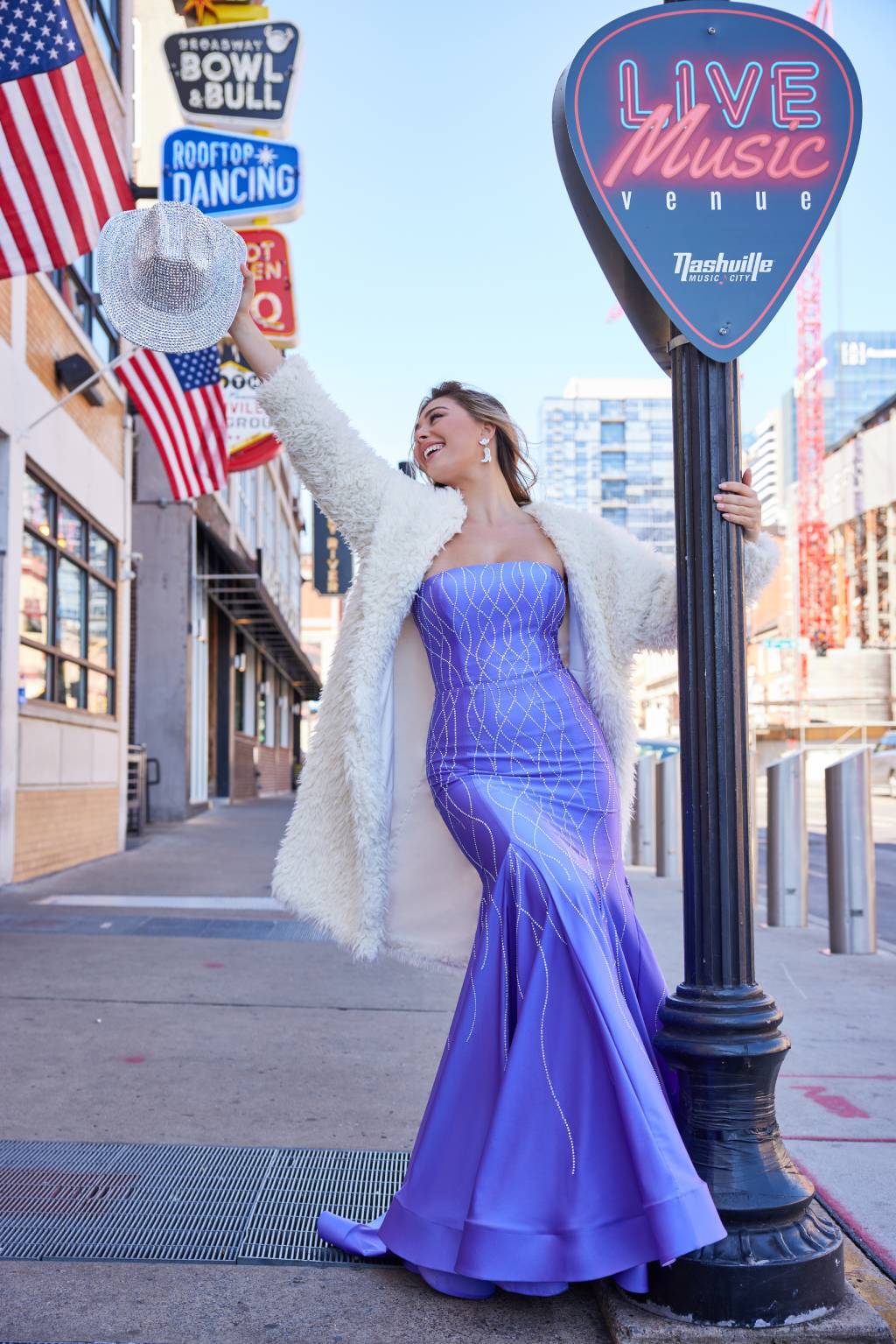 A stunning example of one of the still-trending prom dress colors in jewel tones with delicate, subtle shimmer, perfect for 2026.